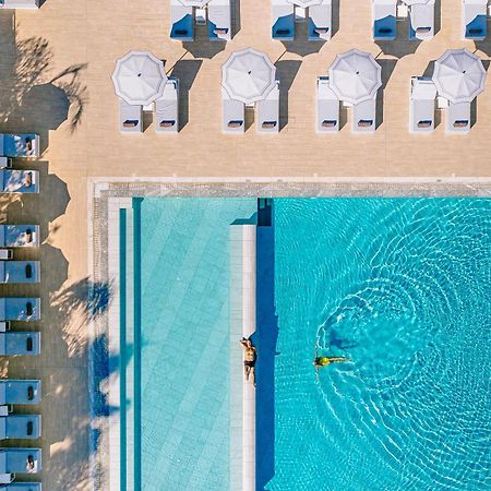 Ivi Mare - Designed For Adults By Louis Hotels Geroskipou Exterior foto Aerial view of the pool at the Hotel du Cap-Eden-Roc, Cap d'Antibes, France